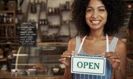 woman-holding-open-sign